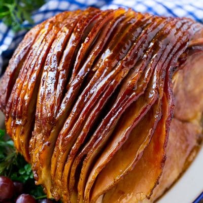 A whole spiral cut coca cola ham on a platter.