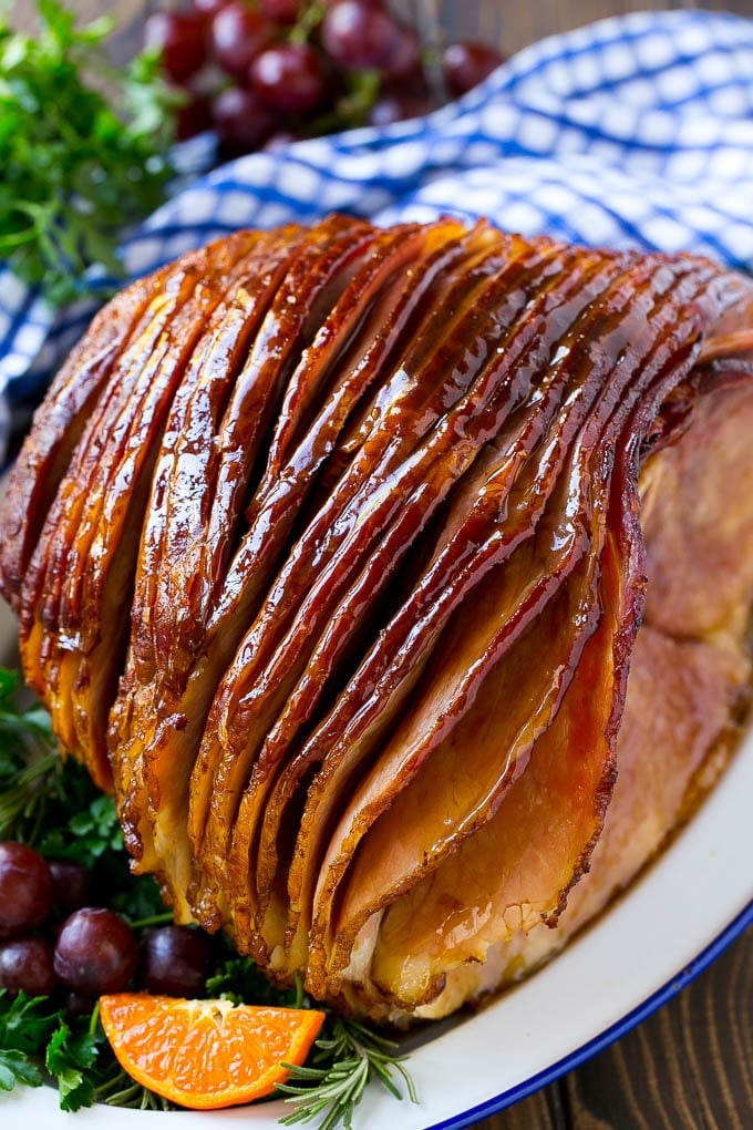 A whole spiral cut coca cola ham on a platter.