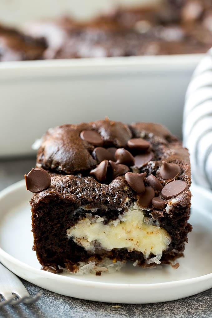 A slice of earthquake cake on a plate.