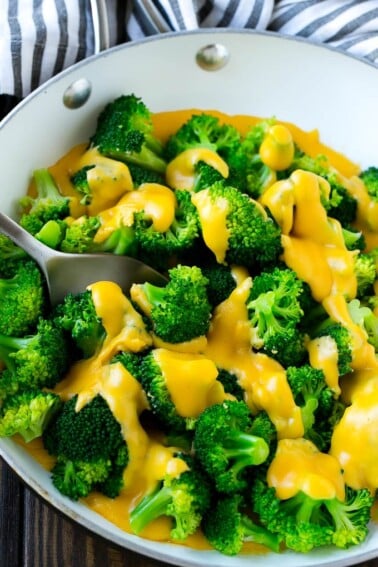 A pan of broccoli with cheese sauce that's full of steamed broccoli florets and homemade sauce.