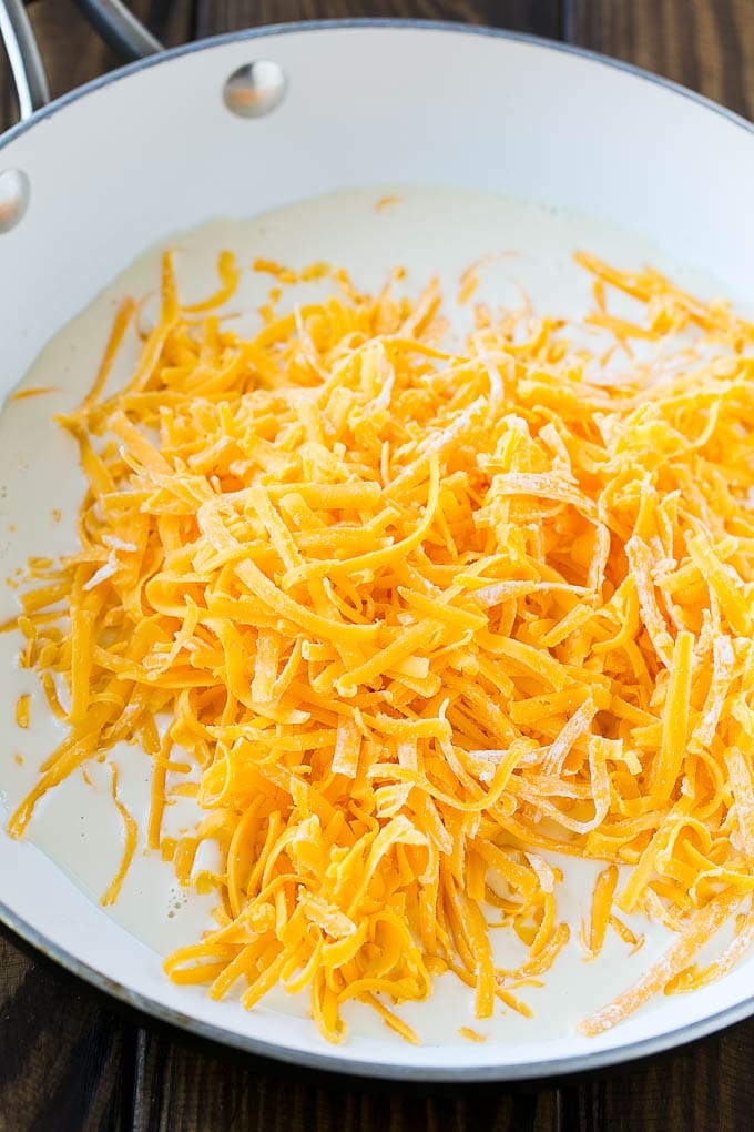 Evaporated milk, shredded cheese and cornstarch in a skillet.