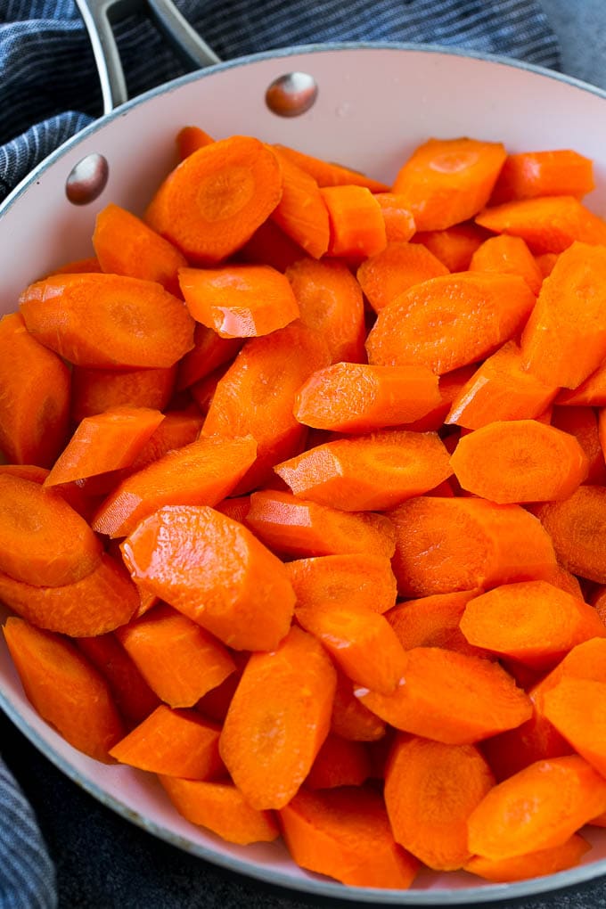 Raw sliced carrots in a pan.