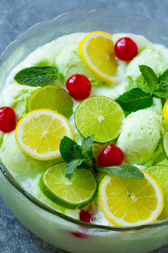 Sherbet punch garnished with cherries, lemons, limes and mint.