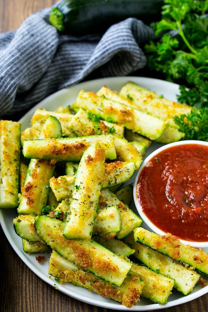 A plate of baked parmesan zucchini spears.