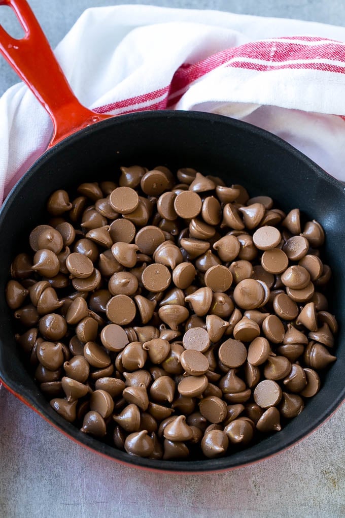 A skillet of milk chocolate chips.