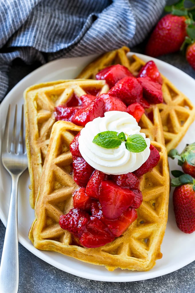 Strawberry waffles topped with homemade sauce.