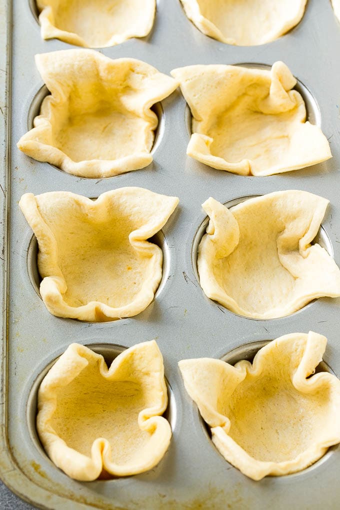 Crescent roll dough pressed into a tin forms the crust.