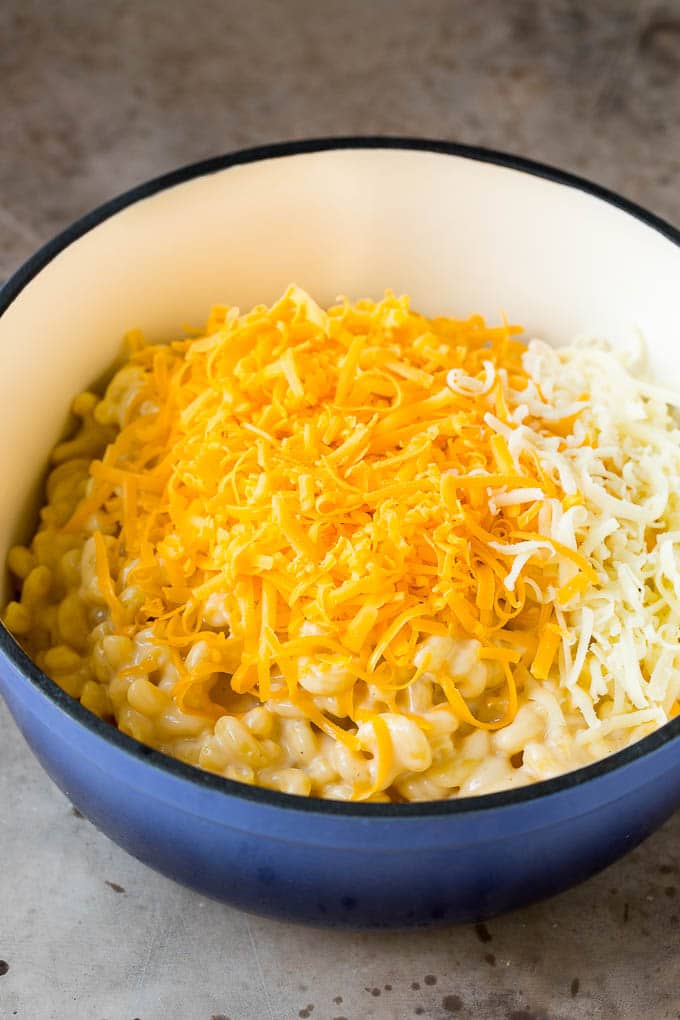 Cooked pasta with two types of shredded cheese.