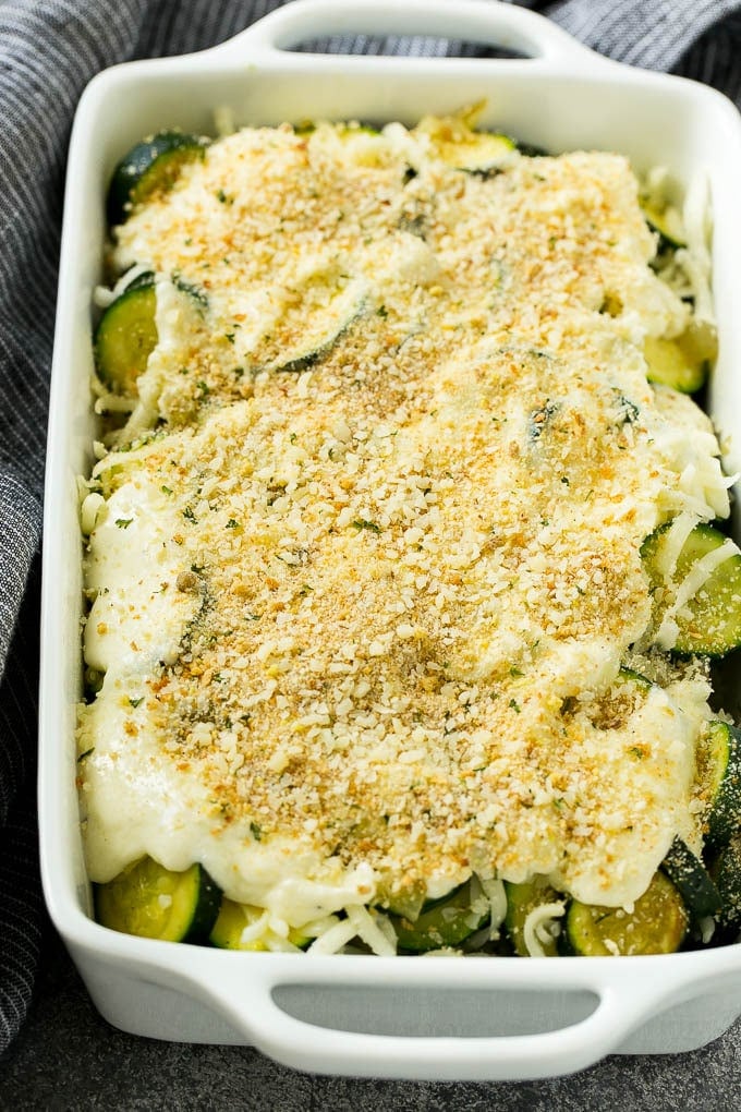 Zucchini Gratin Recipe | Cheesy Zucchini | Baked Zucchini | Easy Zucchini Recipe #zucchini #casserole #cheese #dinner #sidedish #dinneratthezoo Zucchini gratin with layers of cheese, sauce and breadcrumbs, ready to go into the oven.