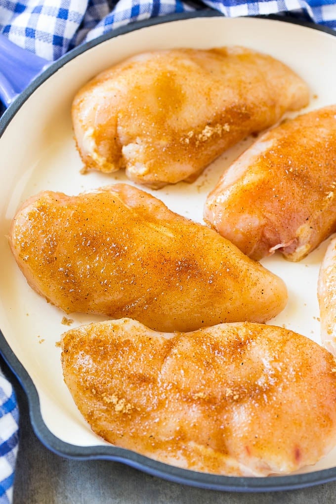 Chicken breasts coated in brown sugar and spices.