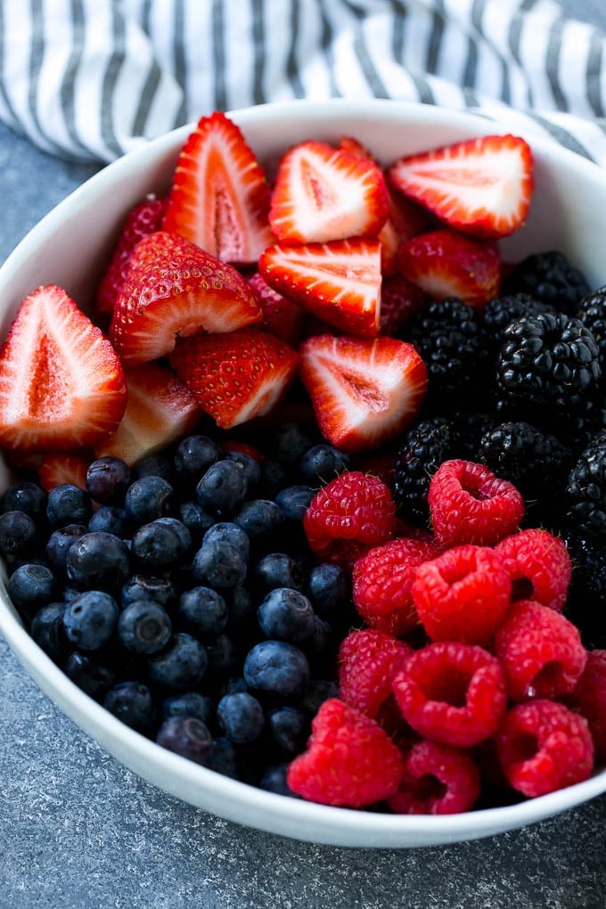 A bowl of blueberries, raspberries, blackberries and strawberries.