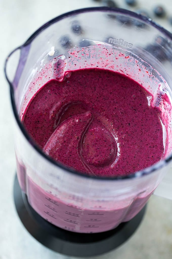 Blueberry smoothie in a blender.