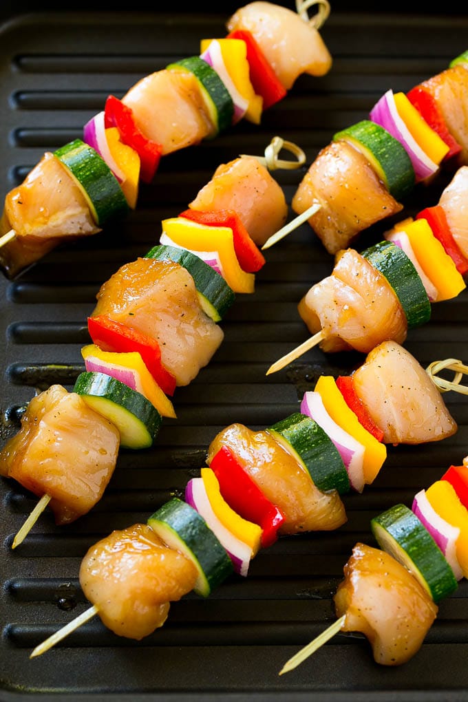 Chicken kabobs on a grill pan.