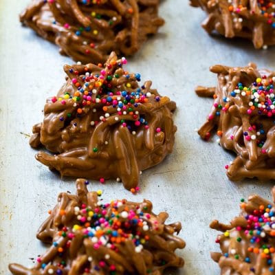 Haystack cookies made with chow mein noodles on a baking sheet.