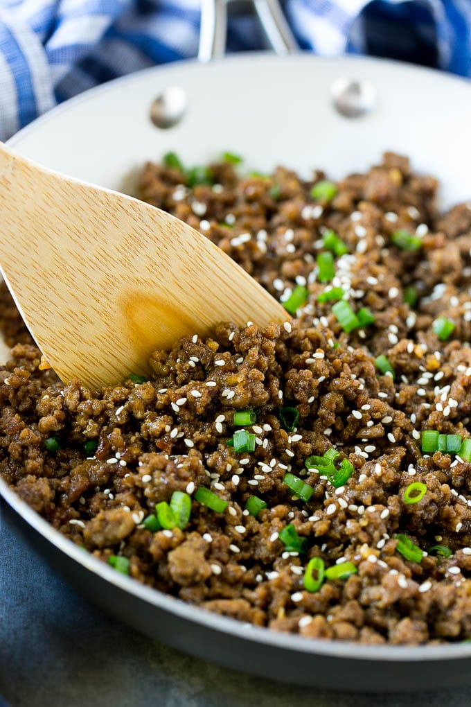 A pan of Korean beef with a spatula.