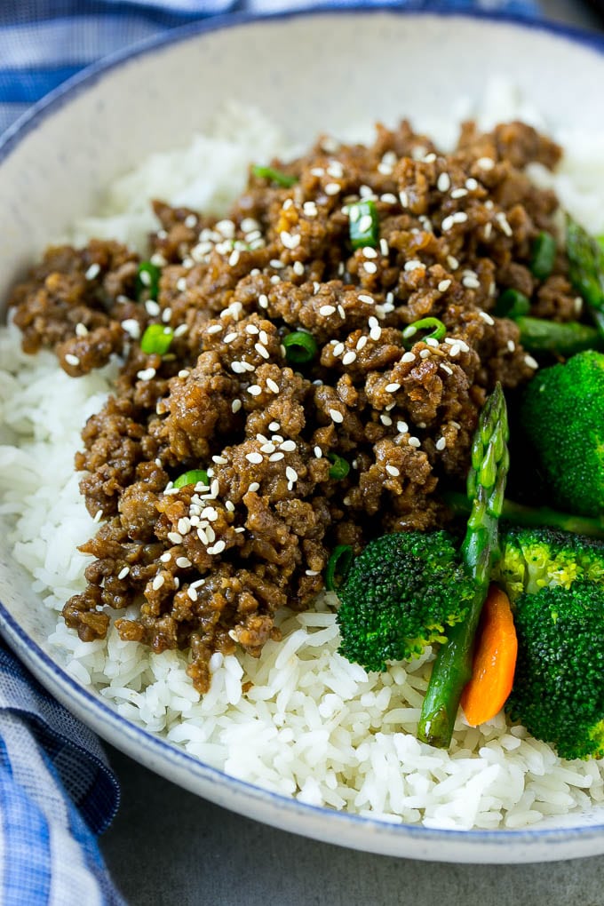 A Korean beef bowl with steamed rice and vegetables.