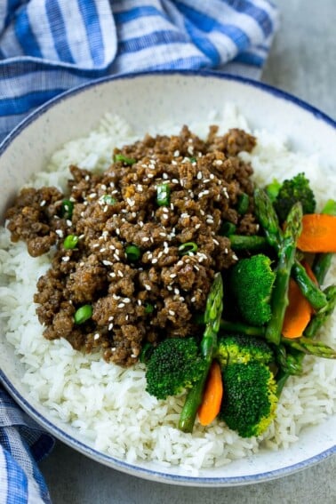 A bowl of rice topped with Korean ground beef and mixed vegetables.