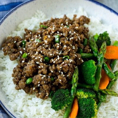 A bowl of rice topped with Korean ground beef and mixed vegetables.