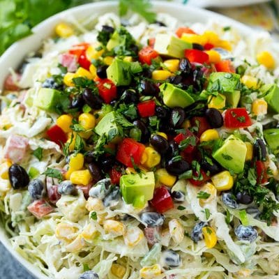 Mexican coleslaw made with cabbage, black beans, corn, red pepper and avocado, tossed in a creamy dressing.