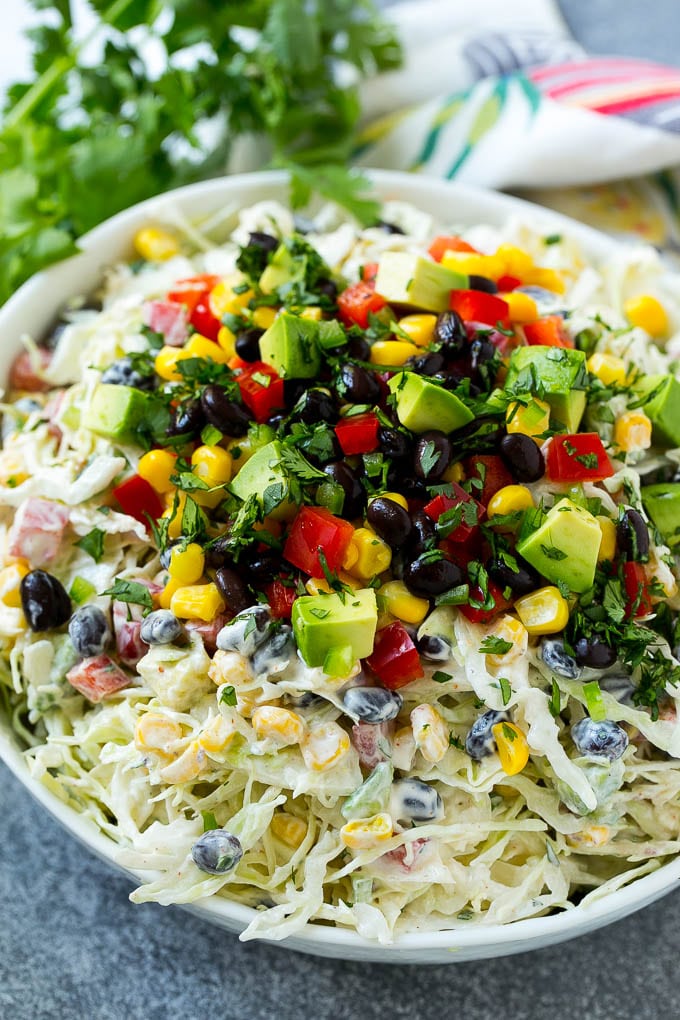 Mexican coleslaw made with cabbage, black beans, corn, red pepper and avocado, tossed in a creamy dressing.