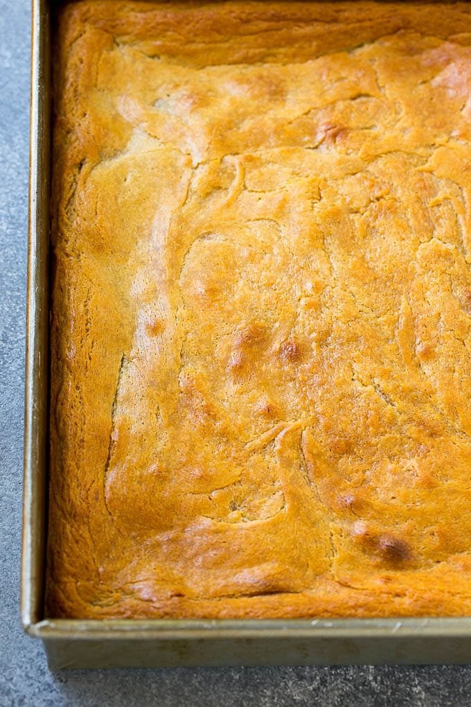 A peanut butter chocolate gooey butter cake in a baking pan.