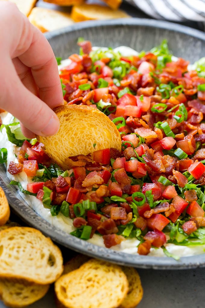 BLT dip with bacon, lettuce, tomato and green onions over a creamy ranch dip. 