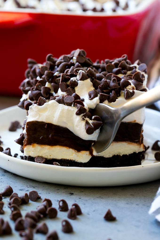 A slice of chocolate lasagna with a fork in it.