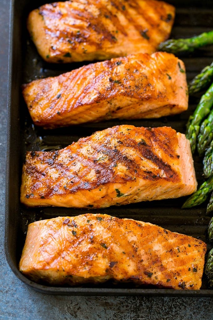 Grilled salmon and asparagus on a grill pan.