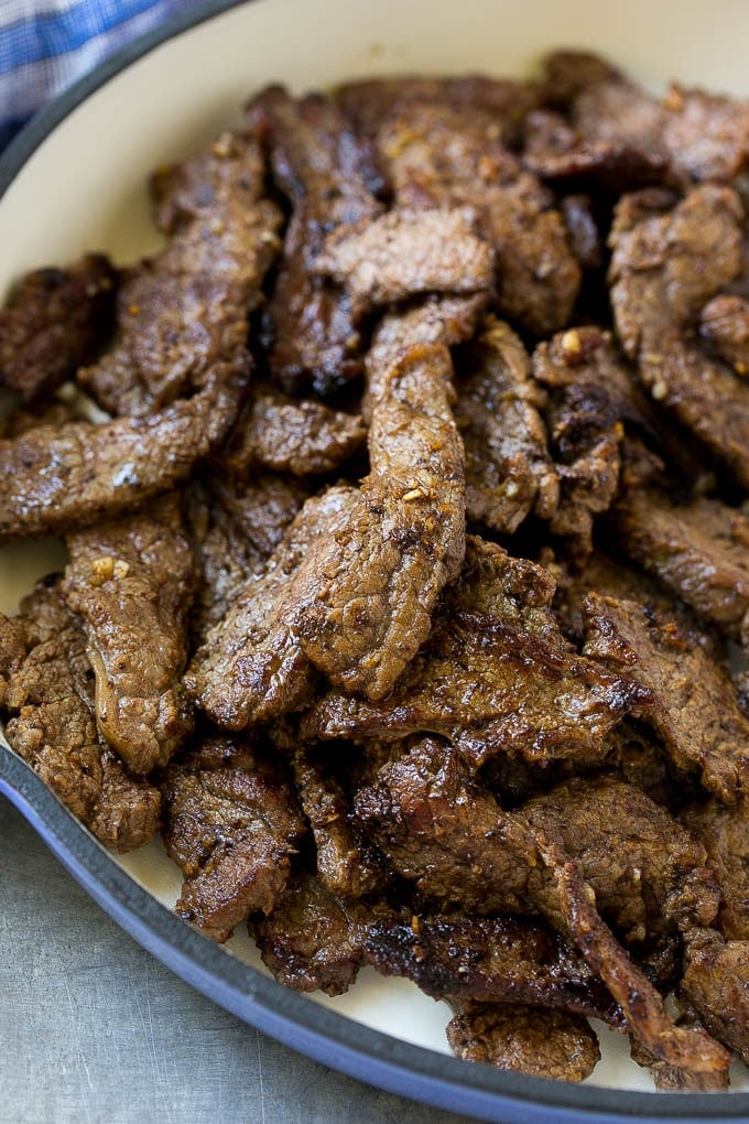 Browned flank steak slices.