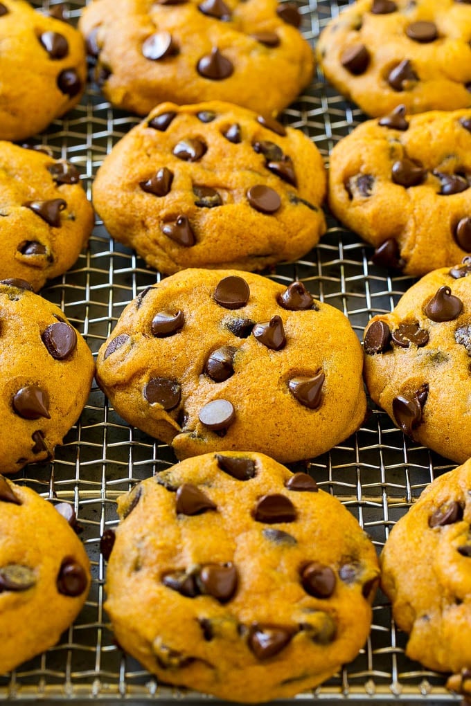 Pumpkin chocolate chip cookies on a cooling rack.