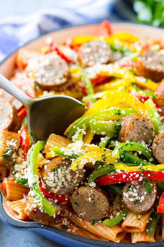 Sausage and pepper pasta with Italian sausage, topped with parmesan cheese.