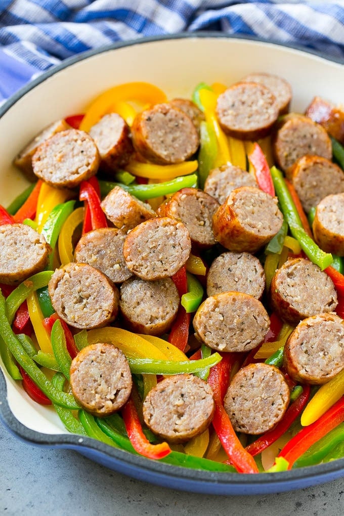 Sausage and peppers in a skillet.