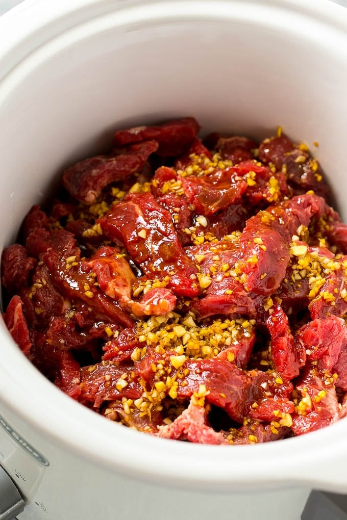 Sliced flank steak topped with a garlic, ginger and soy sauce.