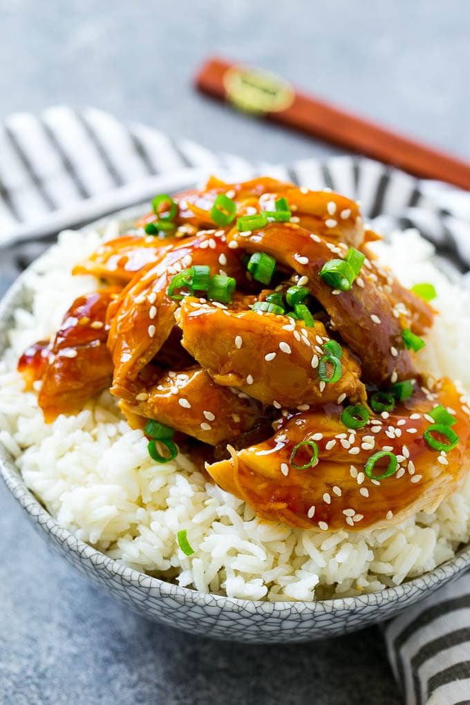 Shredded slow cooker teriyaki chicken served over rice.