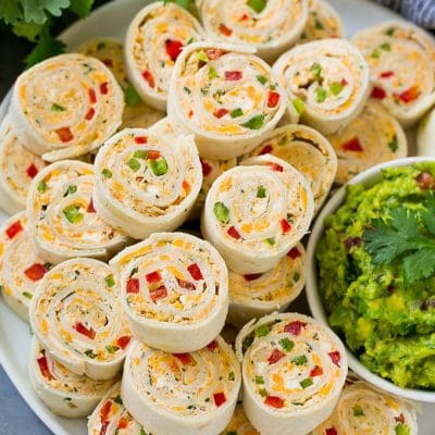 Taco pinwheels made with cream cheese, chicken, cheddar cheese and bell peppers.