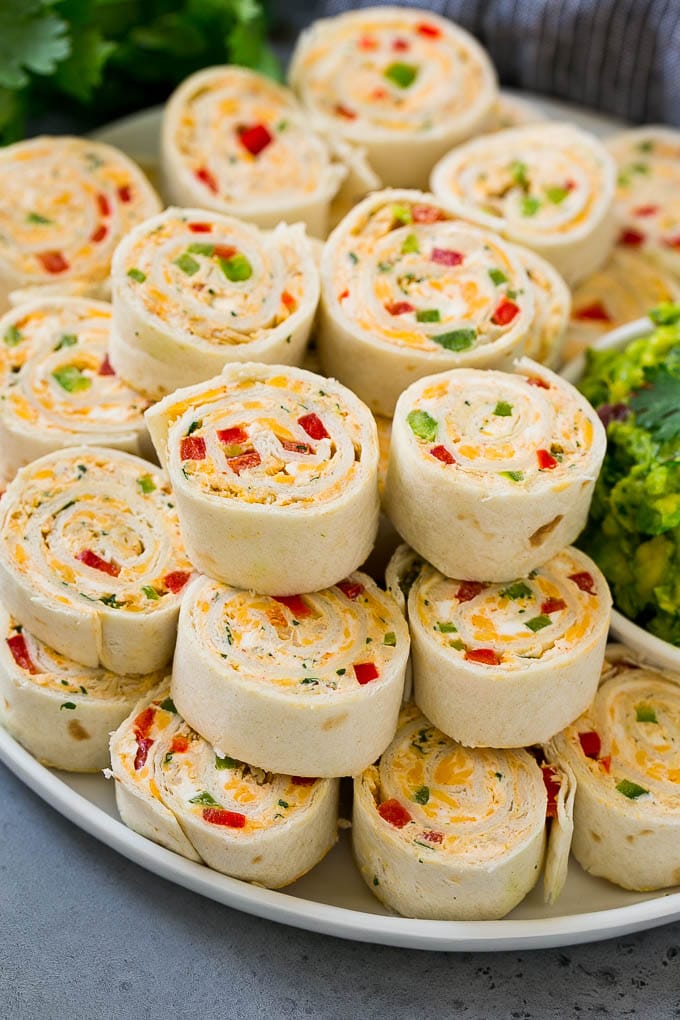 A plate of taco pinwheels made with tortillas.