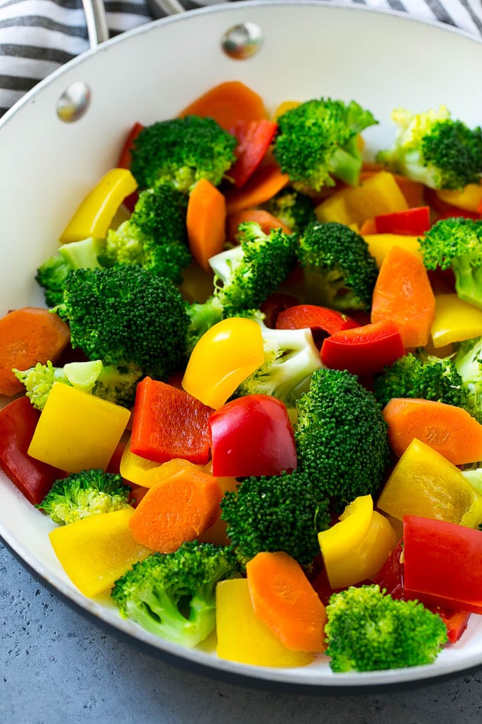 Broccoli, carrots and peppers in a pan.