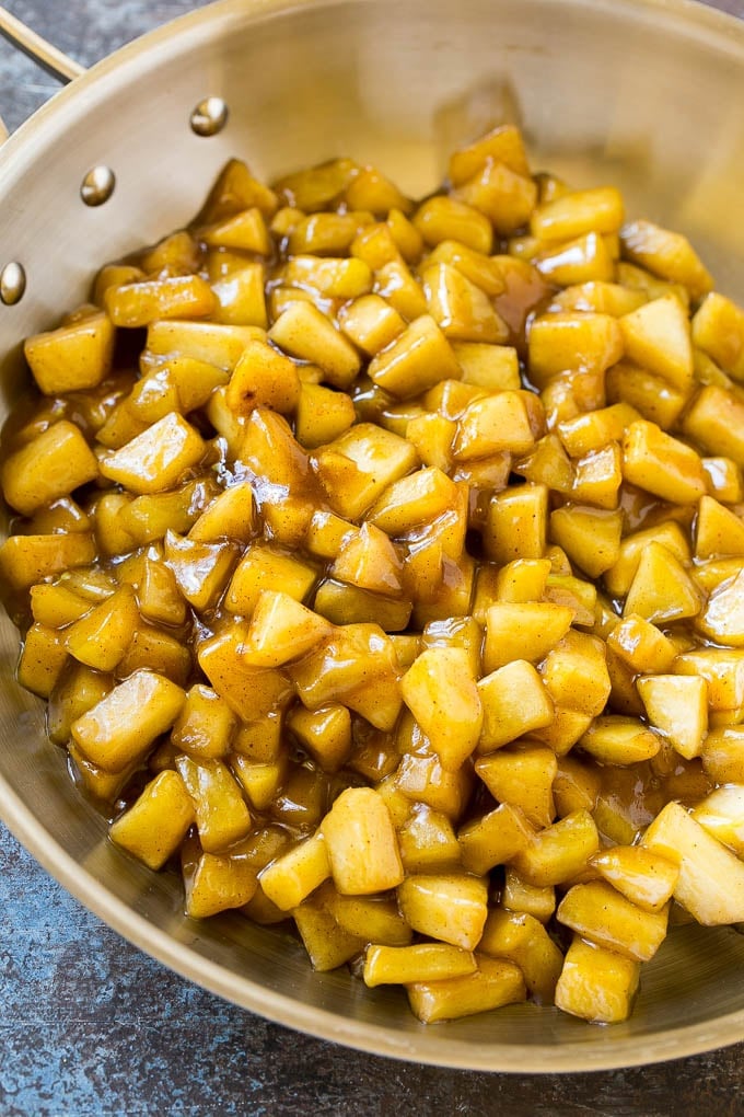 Homemade apple pie filling in a skillet.