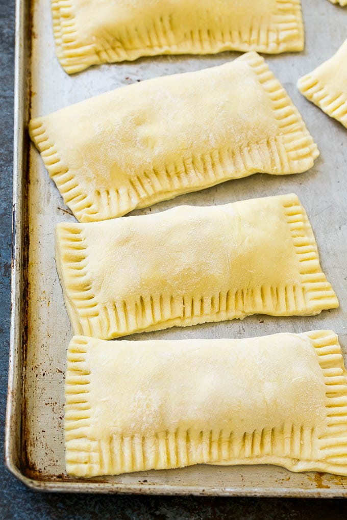 Puff pastry apple hand pies ready to go into the fryer.