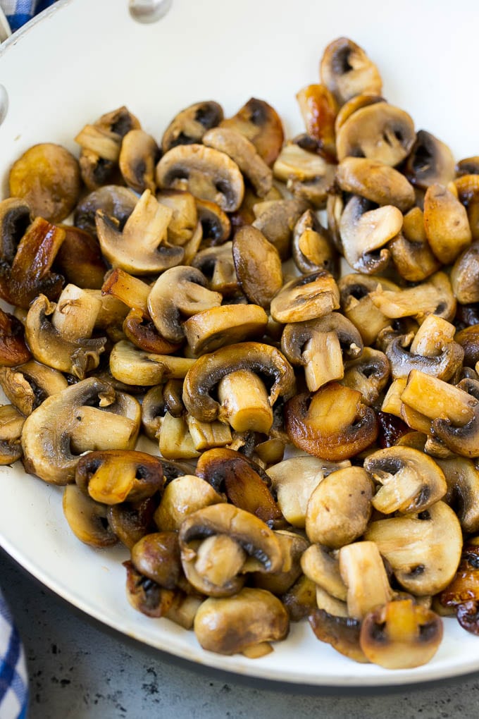 Sauteed mushrooms in a skillet.