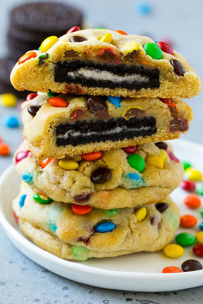 Oreo Stuffed Cookies Recipe | M&M's cookies | Stuffed Cookies #cookies #chocolate #oreos #dessert #baking #dinneratthezoo A stack of Oreo stuffed cookies on a plate.