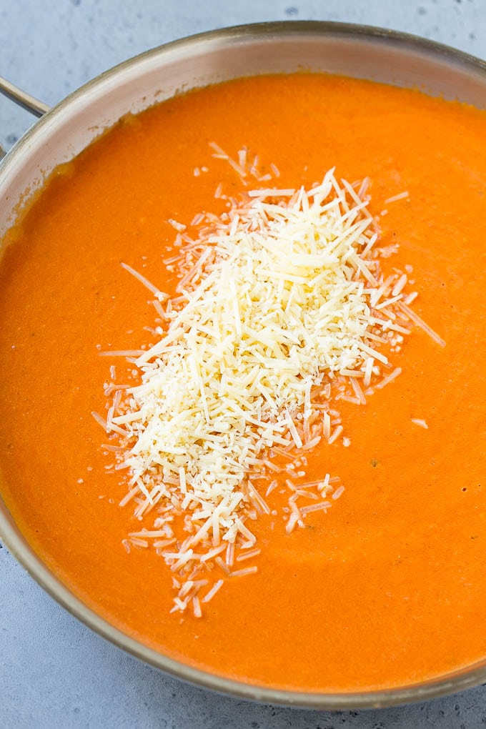 Creamy tomato sauce with parmesan cheese in it.