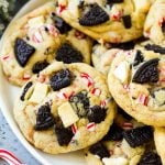 A plate of Oreo peppermint cookies filled with white chocolate and candy canes.