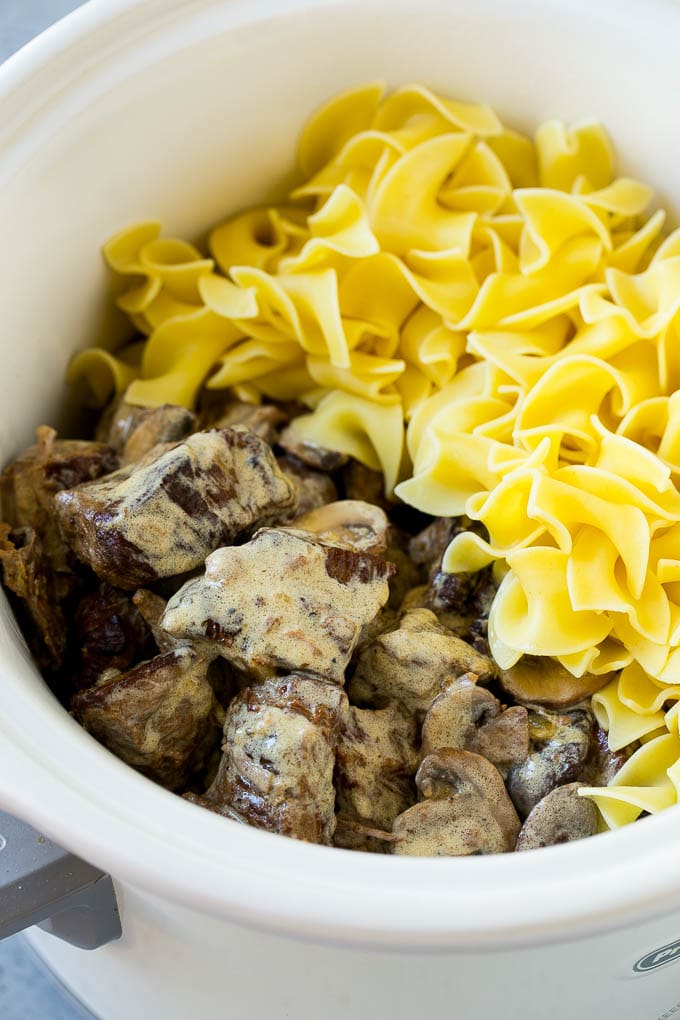 Beef in a creamy sauce and egg noodles in a slow cooker.