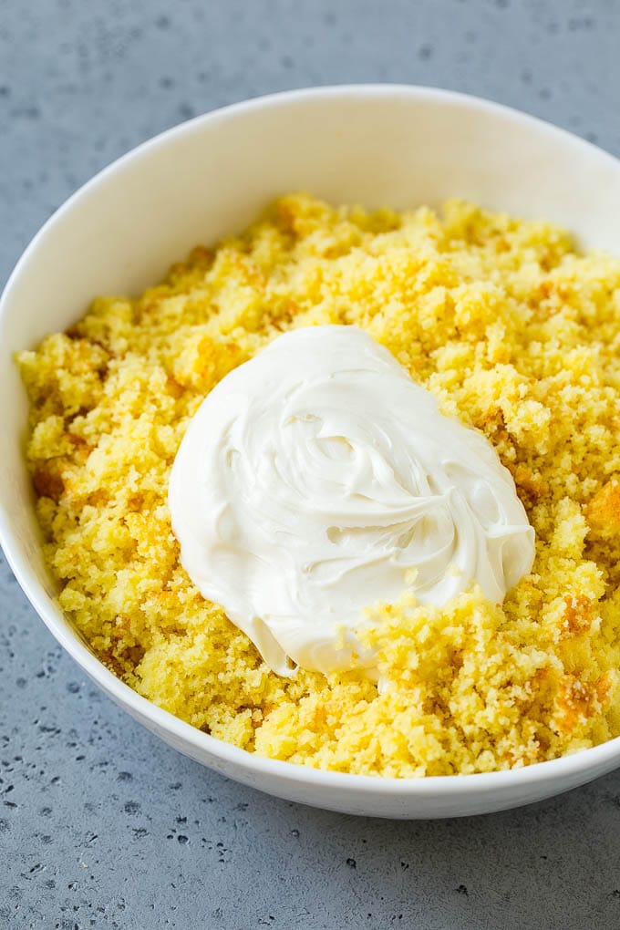 Cake crumbs with frosting in a bowl.