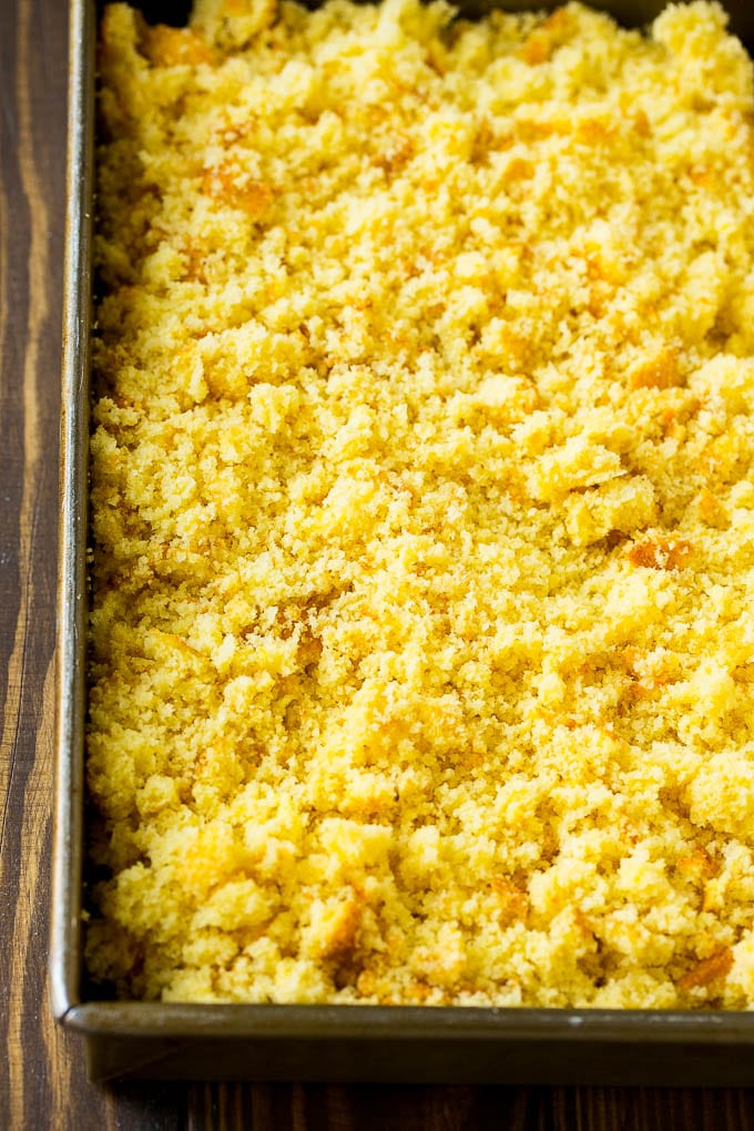 A pan of crumbled yellow cake.