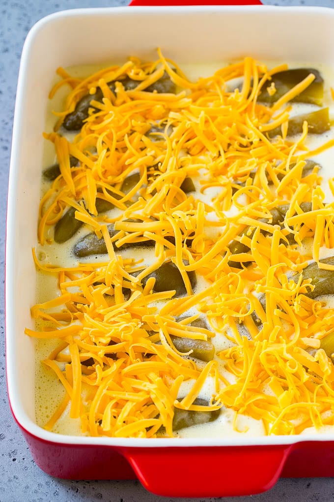 Green chiles in an egg batter topped with shredded cheddar cheese.