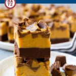 This recipe for chocolate peanut butter fudge is a layered treat made with two types of fudge and topped with peanut butter cups.