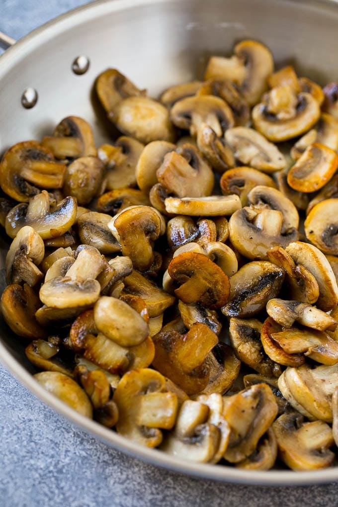 Sauteed mushrooms in a skillet.