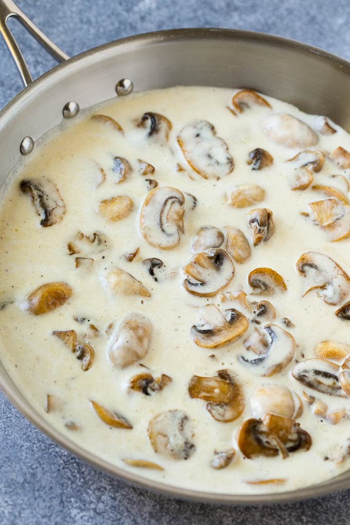 Creamy mushroom sauce in a frying pan.
